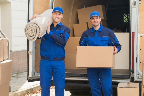 Professional movers handling furniture in a Richmond upon Thames property