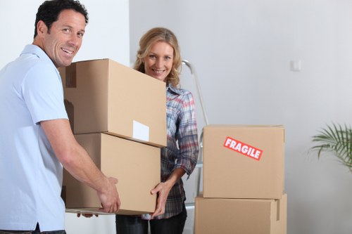 Packed office boxes and furniture ready for transport in a local business move
